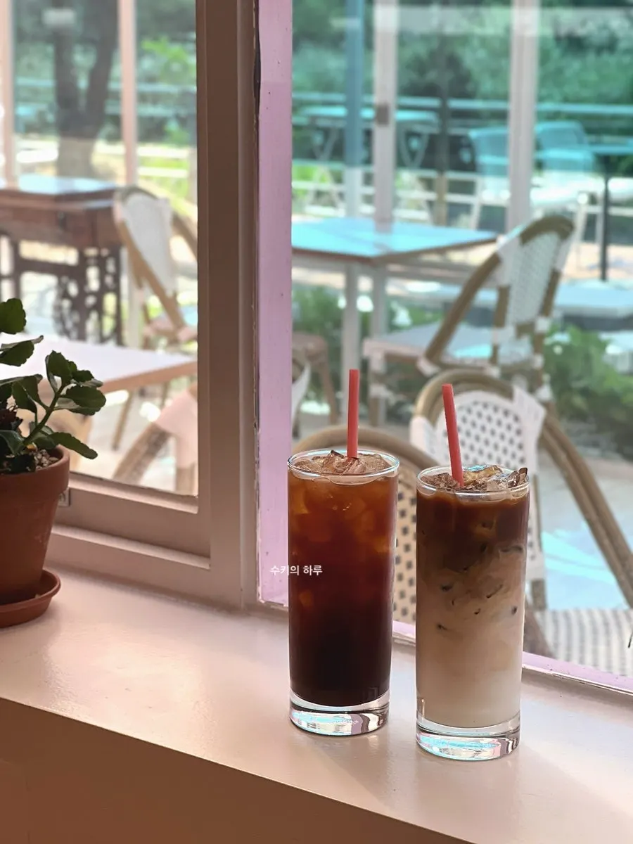 Iced drinks set at a window seat