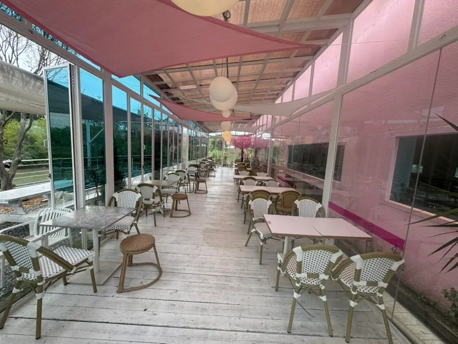 Spacious outdoor seating beside Pink Wall Cafe