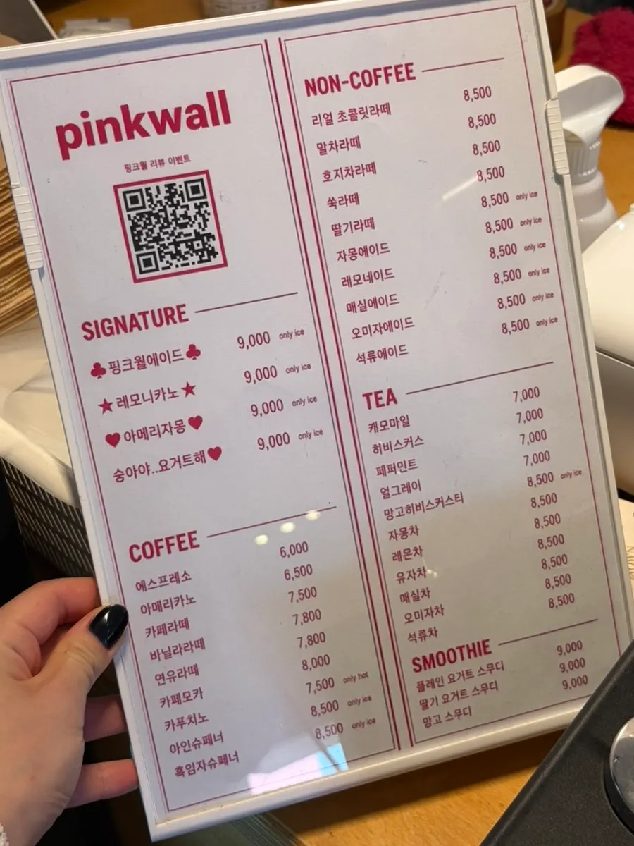 Pink Wall Cafe's drink menu board