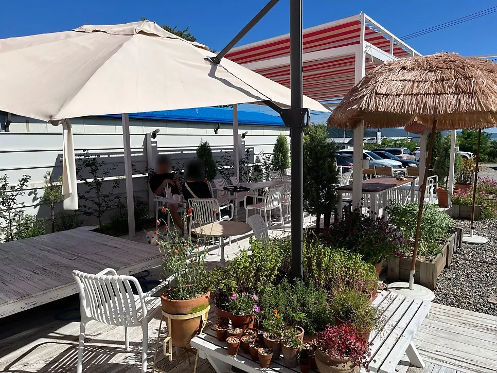 Outdoor terrace seating with a sun shade