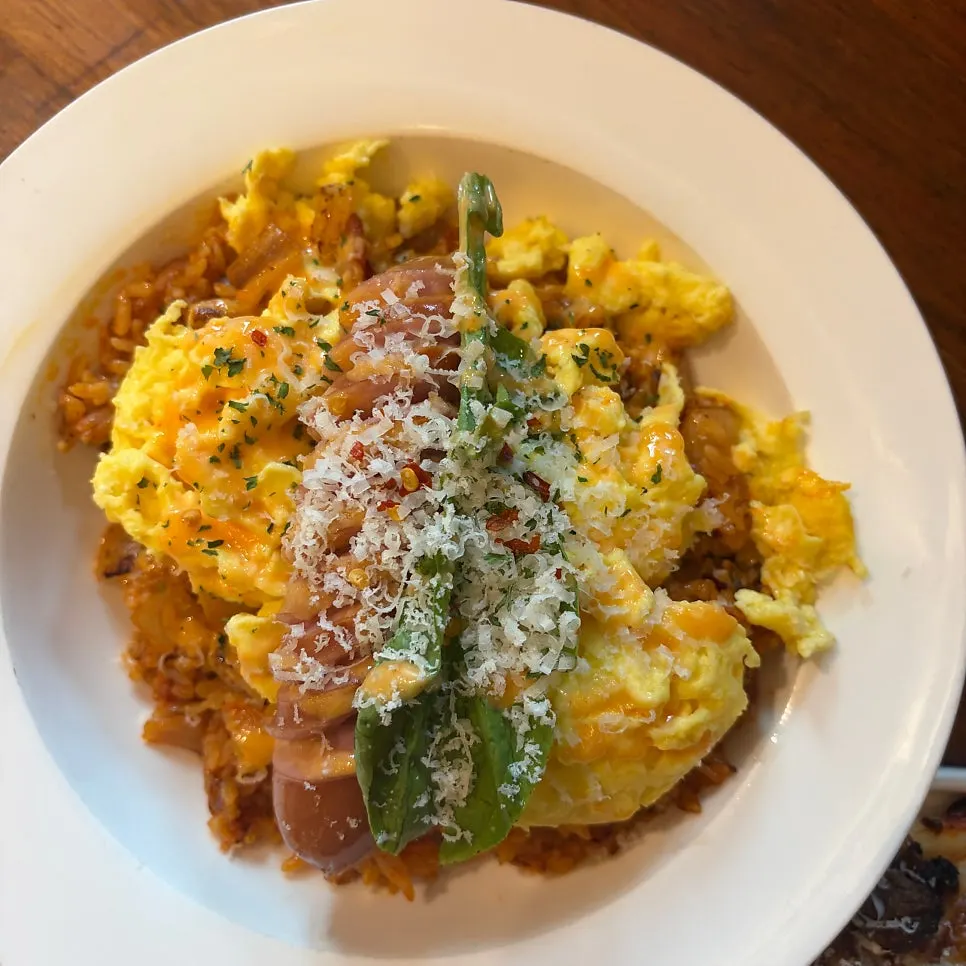 Special-sauce kimchi pilaf topped with scrambled egg and sausage