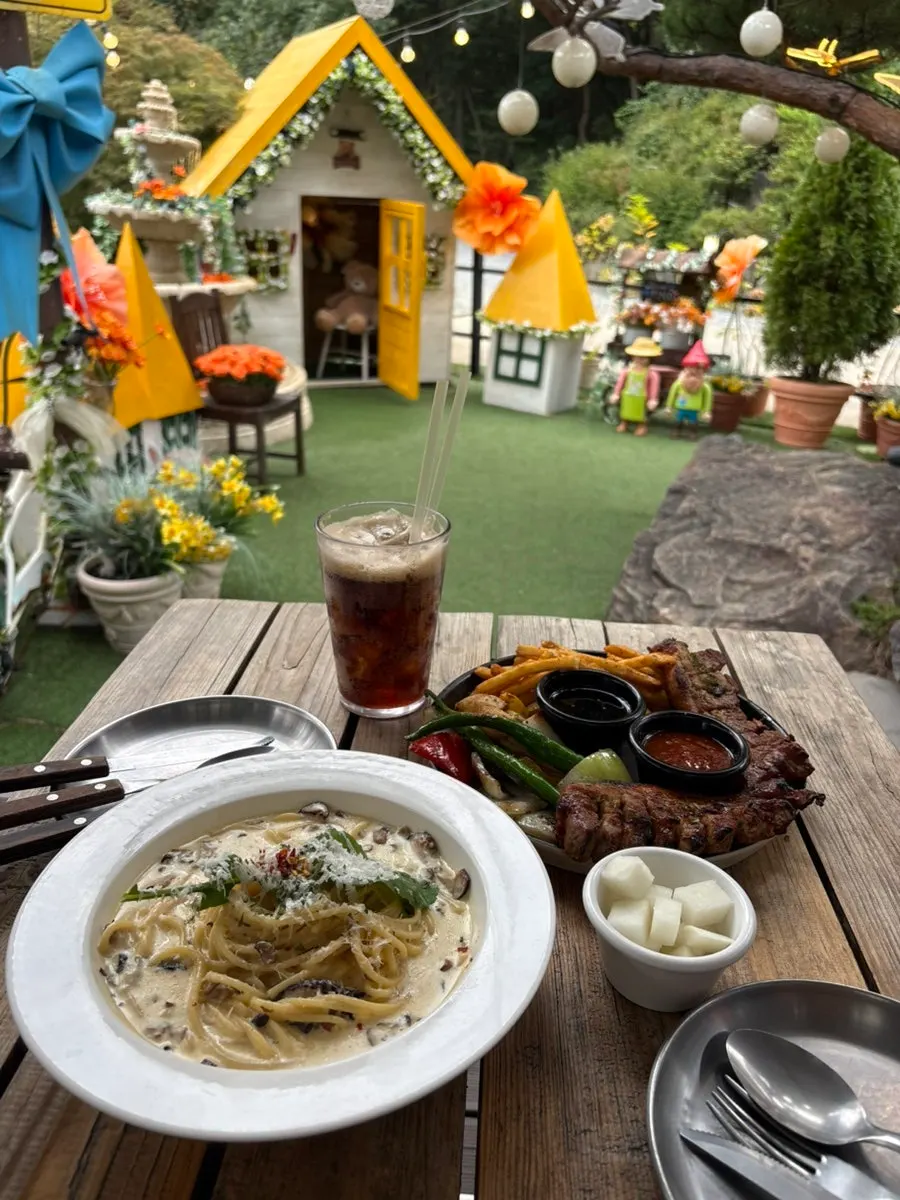 Outdoor seating at Pino Cafe on a clear day