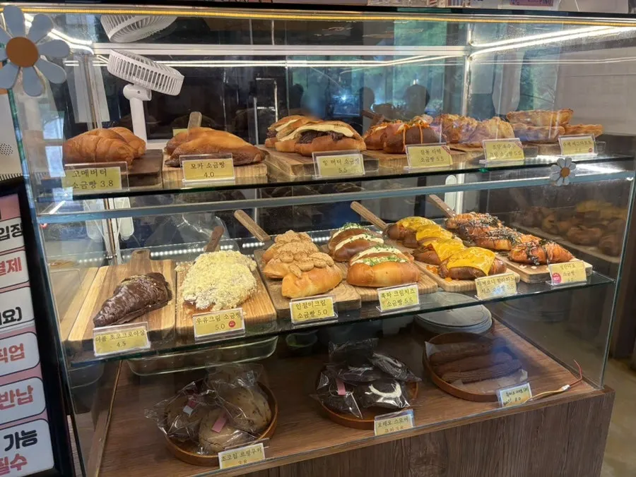 Pino Cafe's bakery display with salt bread and more