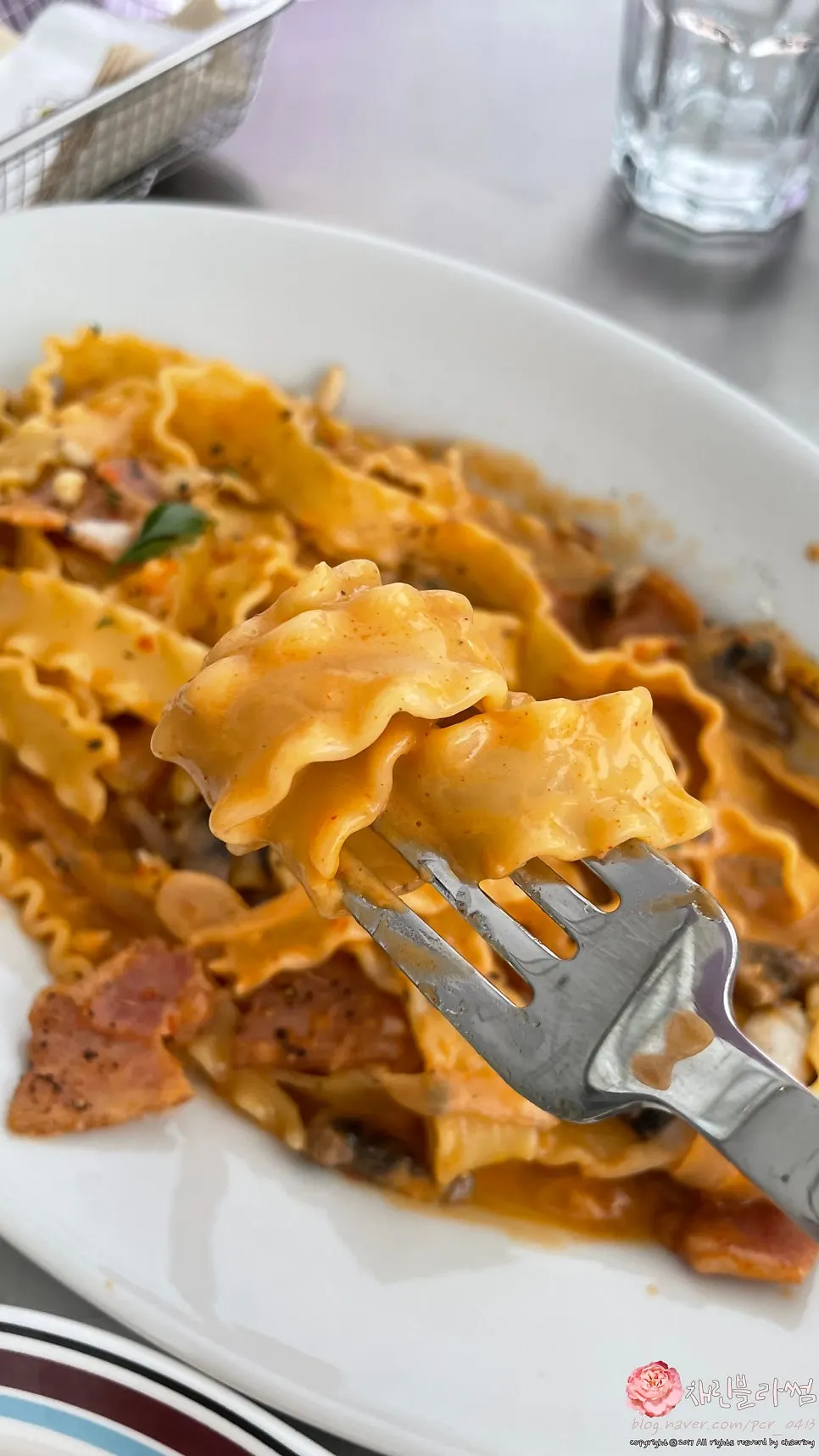 Close-up of wavy mafaldine noodles in cream pasta