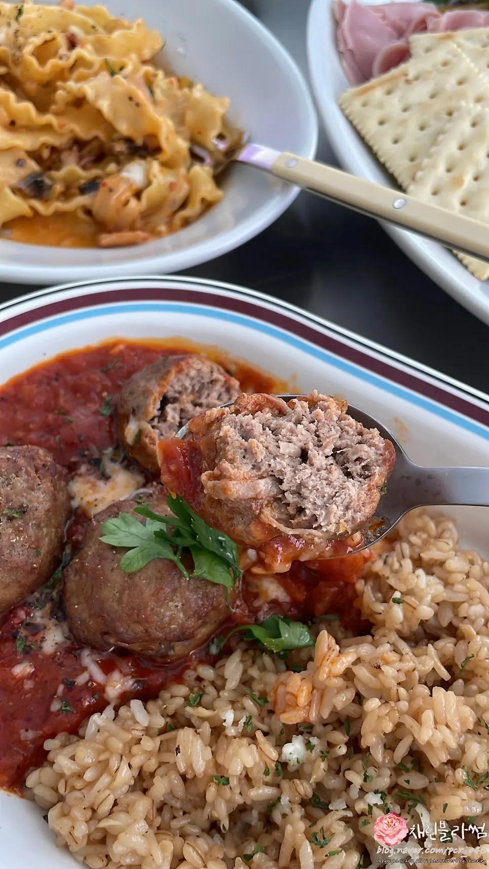 Cutting a meatball to eat with the fried rice