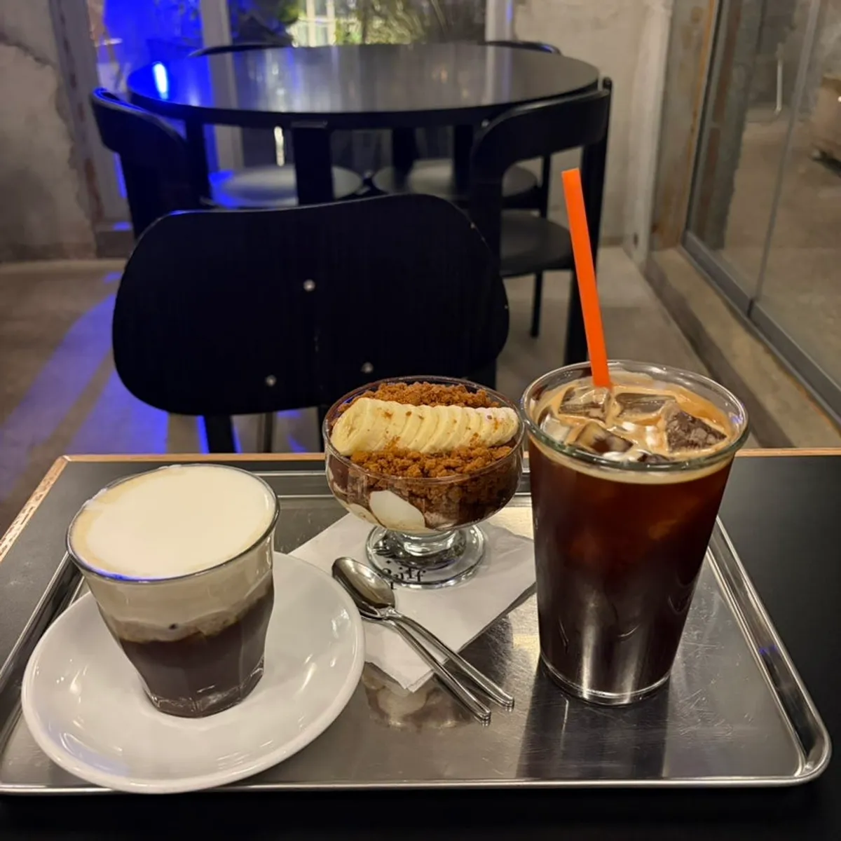 Table spread with Pip Coffee, Americano, and Tiramisu Banana Crumble
