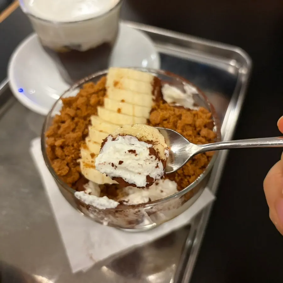 Bite of tiramisu showing cream and sheet together