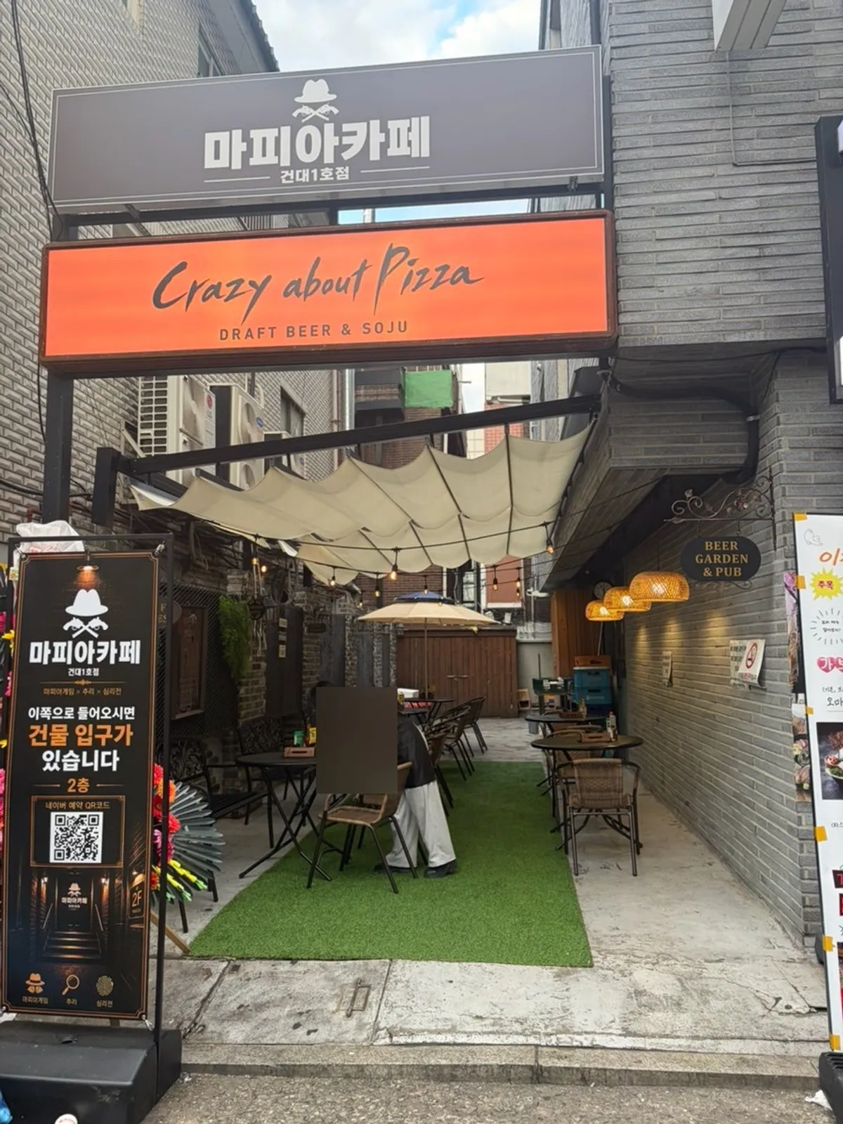 Entrance with orange "Crazy about Pizza" sign