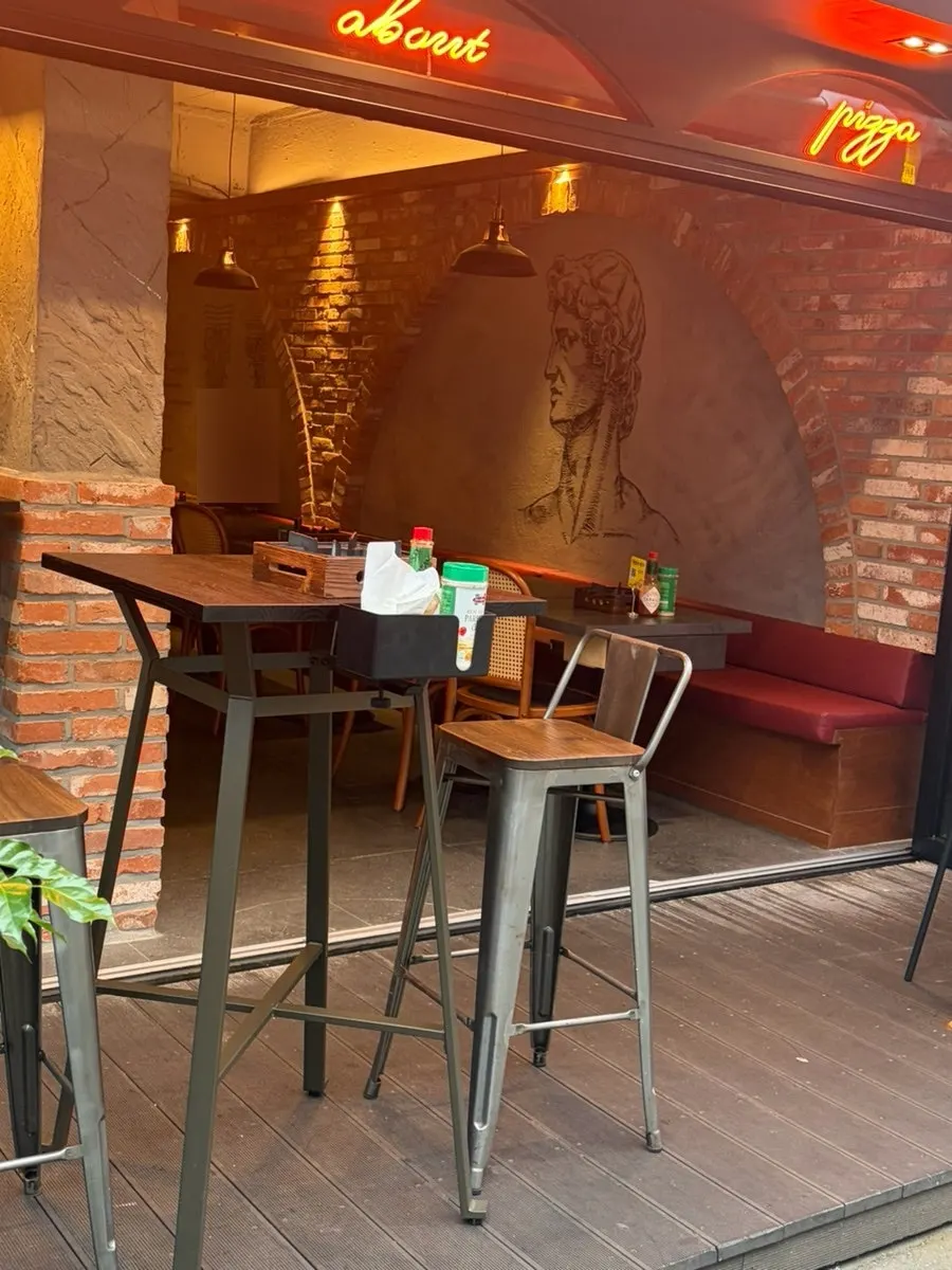 Outdoor tables set up in front of the restaurant