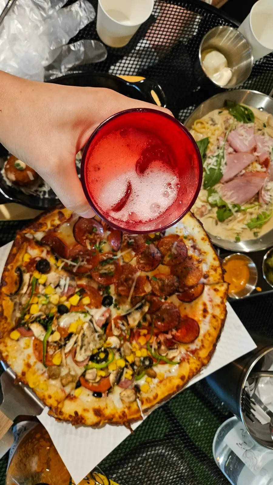Patio seating where guests enjoy pizza and beer