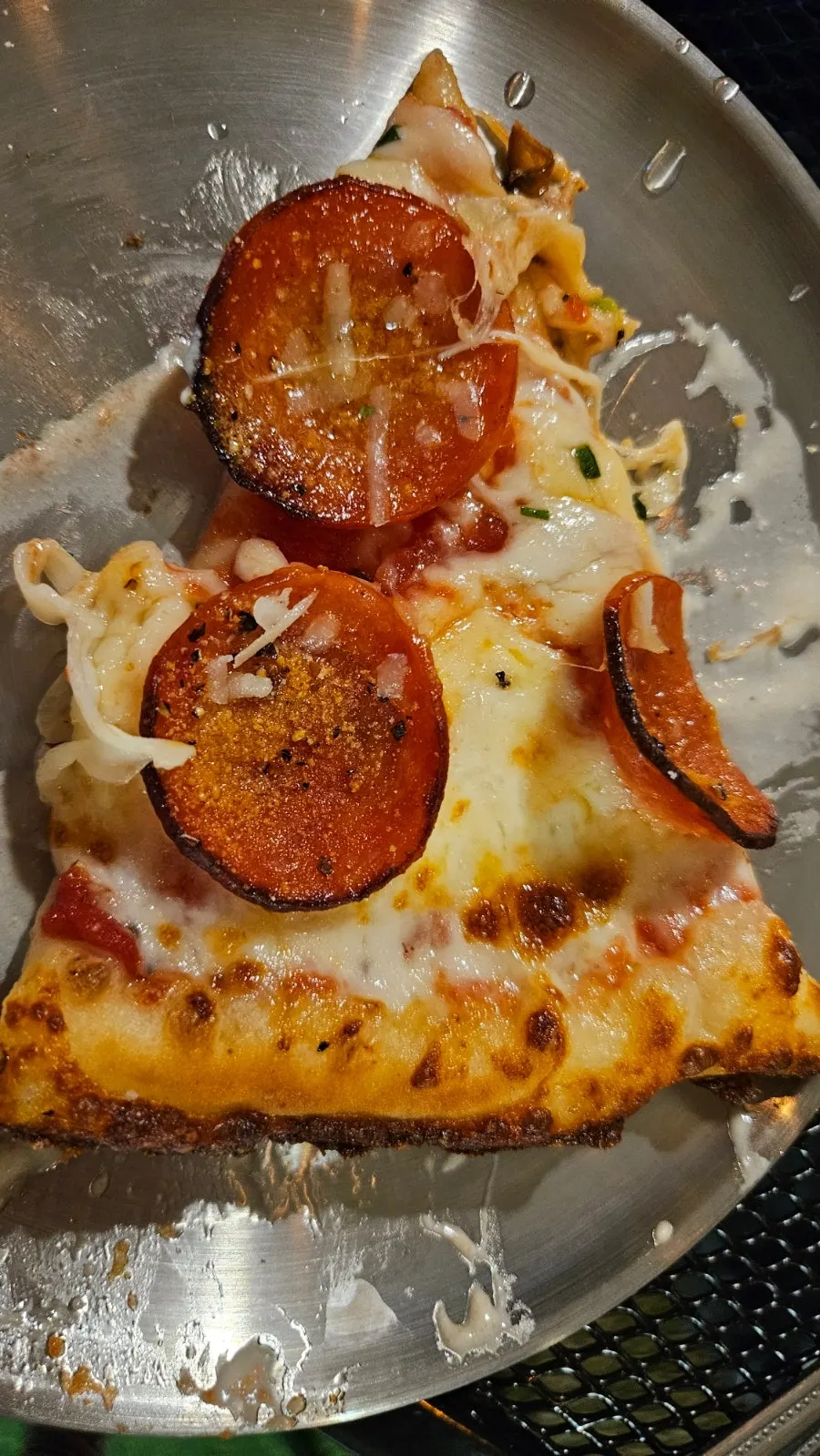 Pizza and drinks set on the patio table