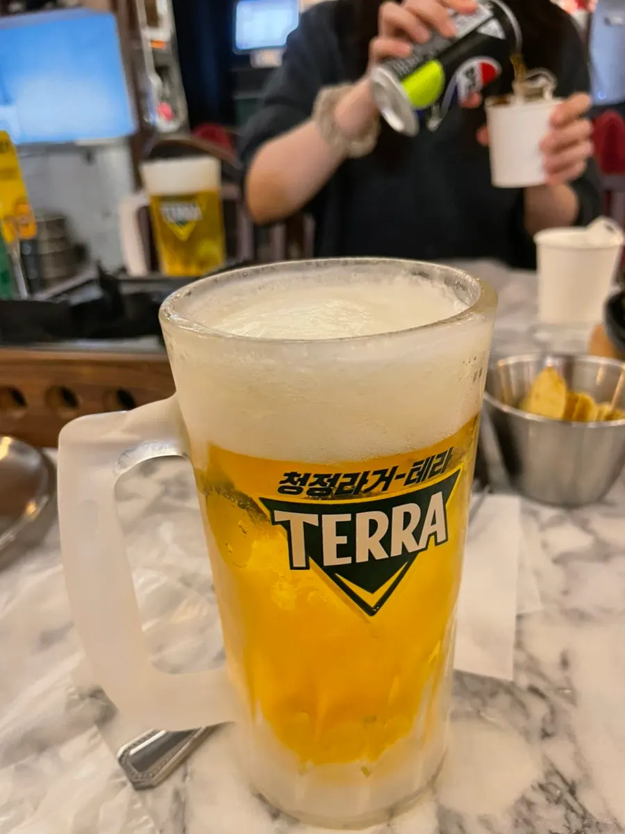 Beer prepared alongside the pizza