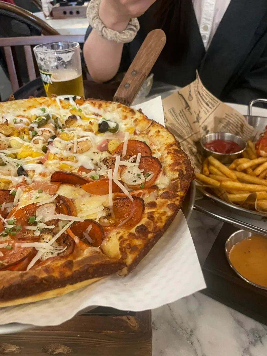 Half-and-half pizza slices split into two flavors