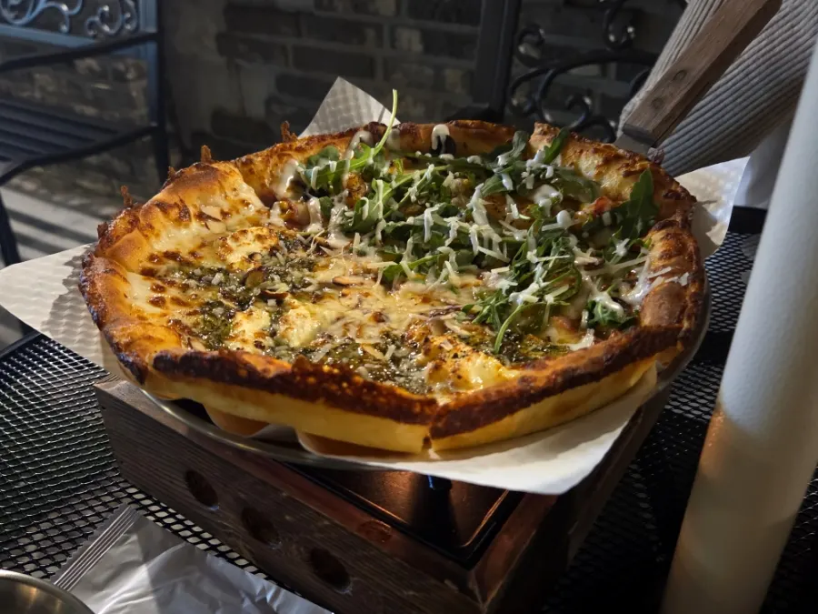 Half-and-half pizza on a candle-warmed plate