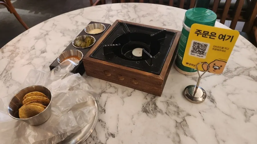 Nachos and sauce set out after ordering