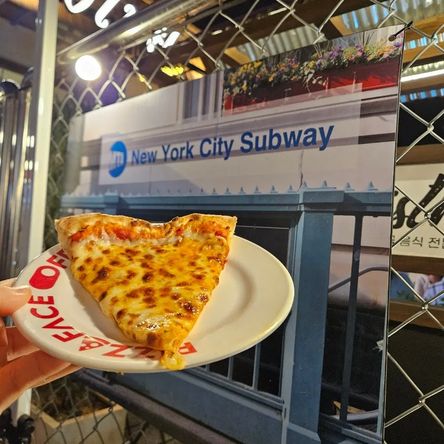 Half-and-half pizza split between double cheese and Face Off