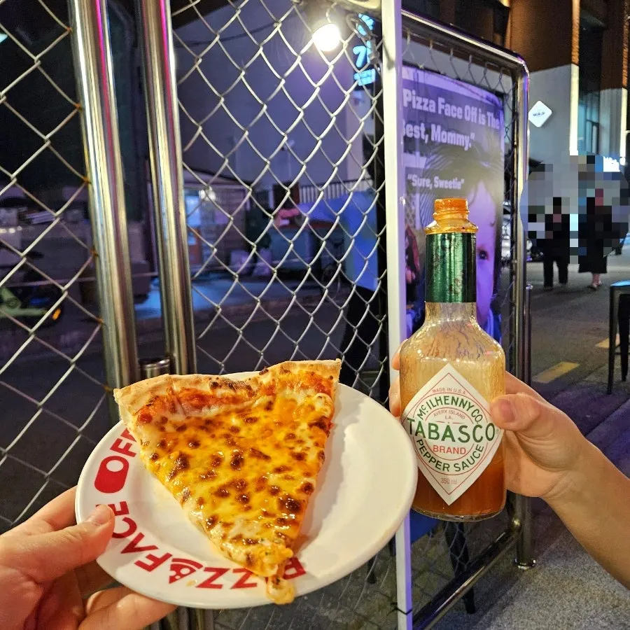 Pizza with a generous amount of added tomato sauce
