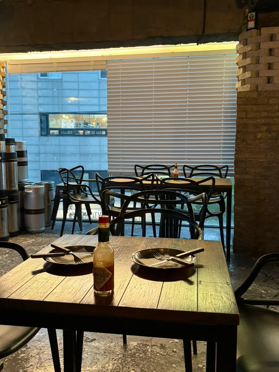 Dimly lit interior of Pizza Never Sleeps