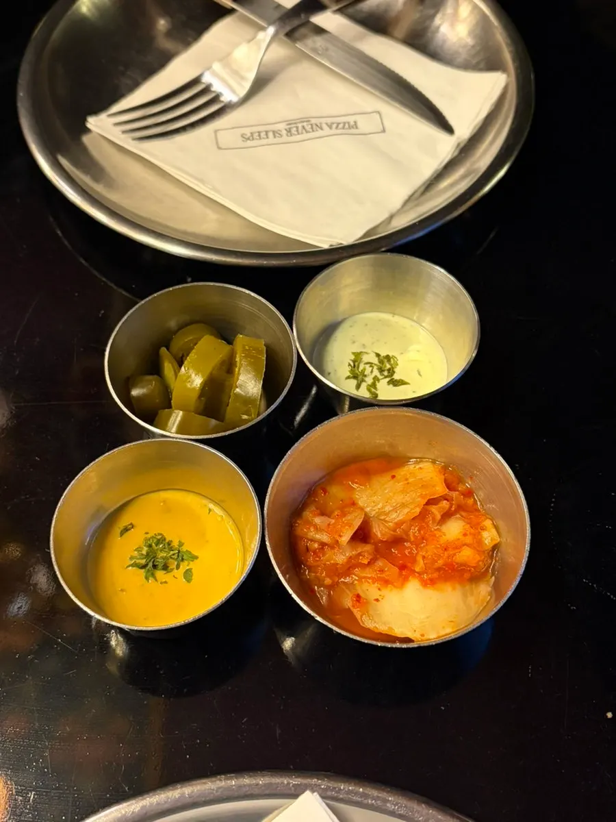 Table setting with deep cheese sauce and kimchi