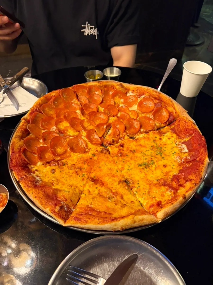 Pizza slice loaded with pepperoni ham