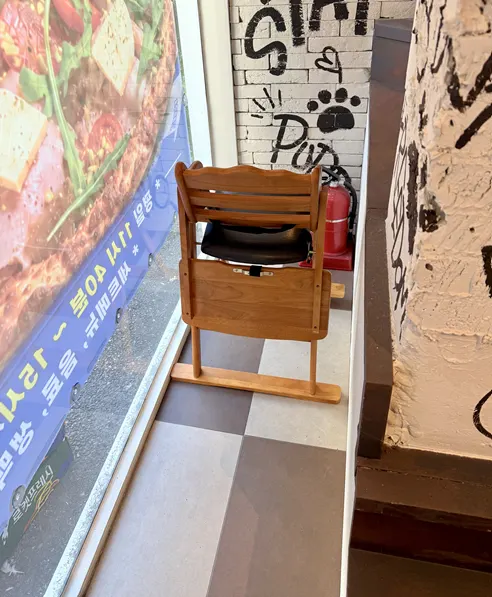 Reserved 2nd-floor seating with a baby chair