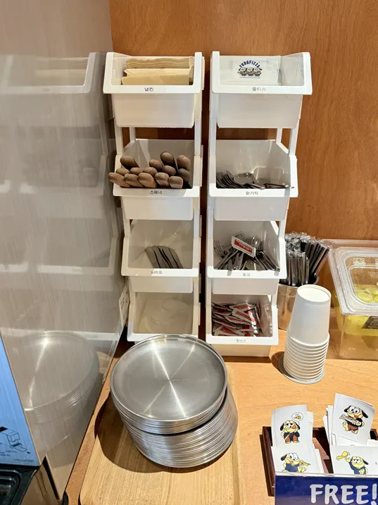 Self-serve corner with water and pickles