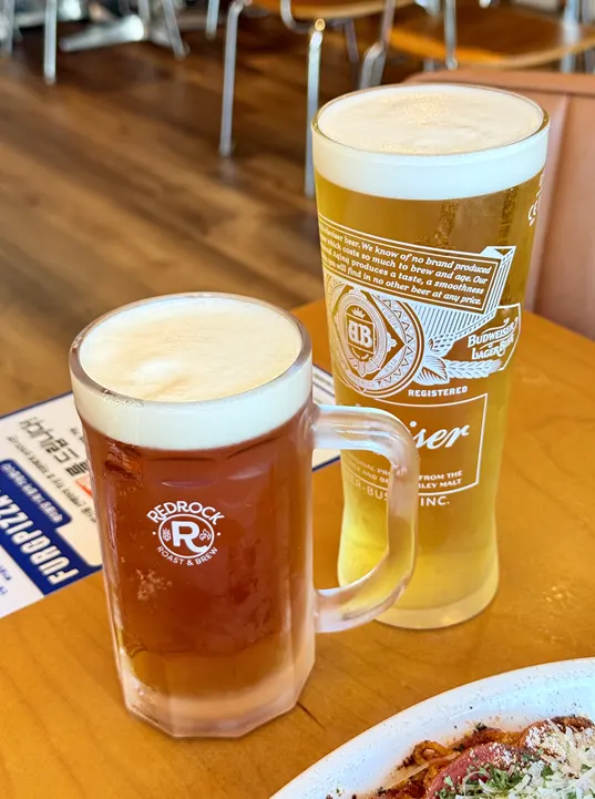 Half-and-half pizza with a glass of draft beer