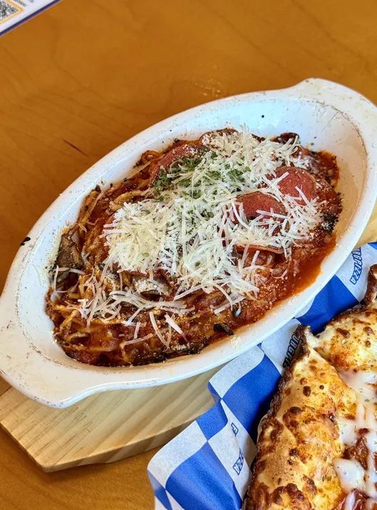 A plate of pepperoni ragu cheese pasta
