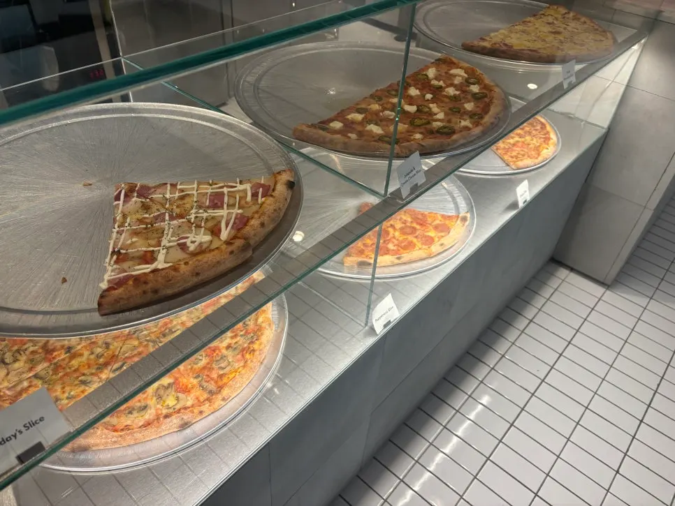 Meatball pizza and bacon potato pizza slices