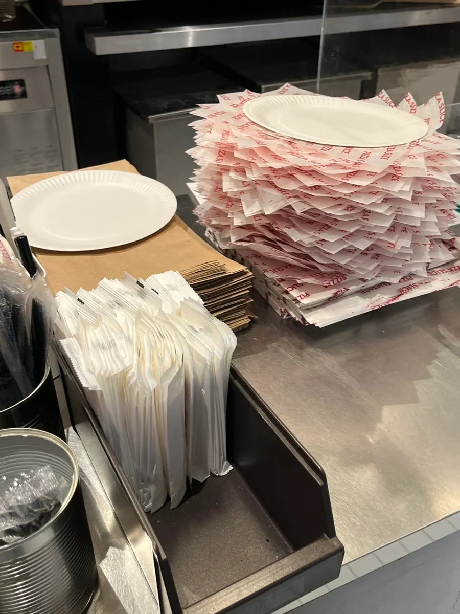 Pizza and side dishes on the counter