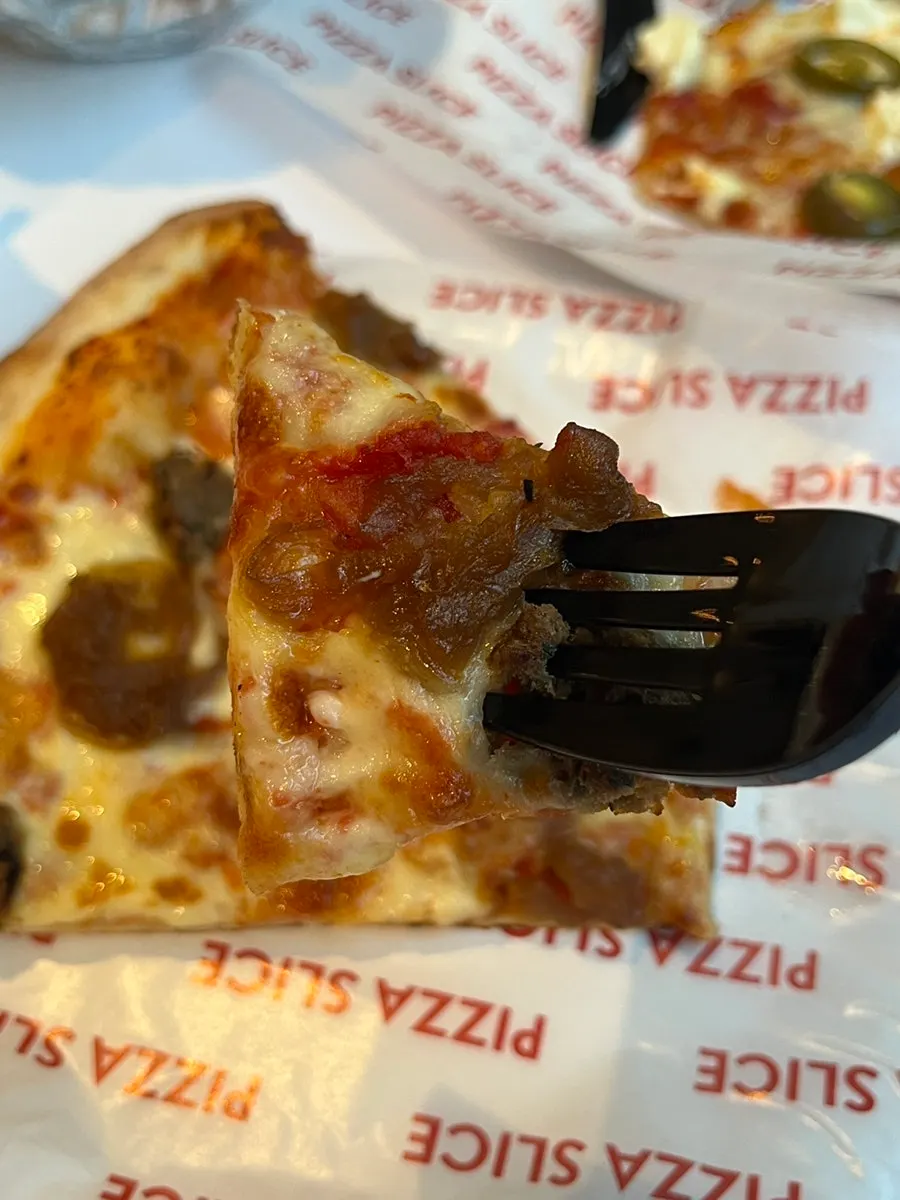 Jalapeño cream cheese pizza slice