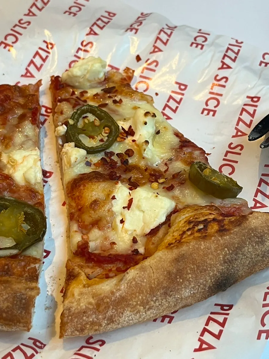Garlic bread dipped in garlic dipping sauce