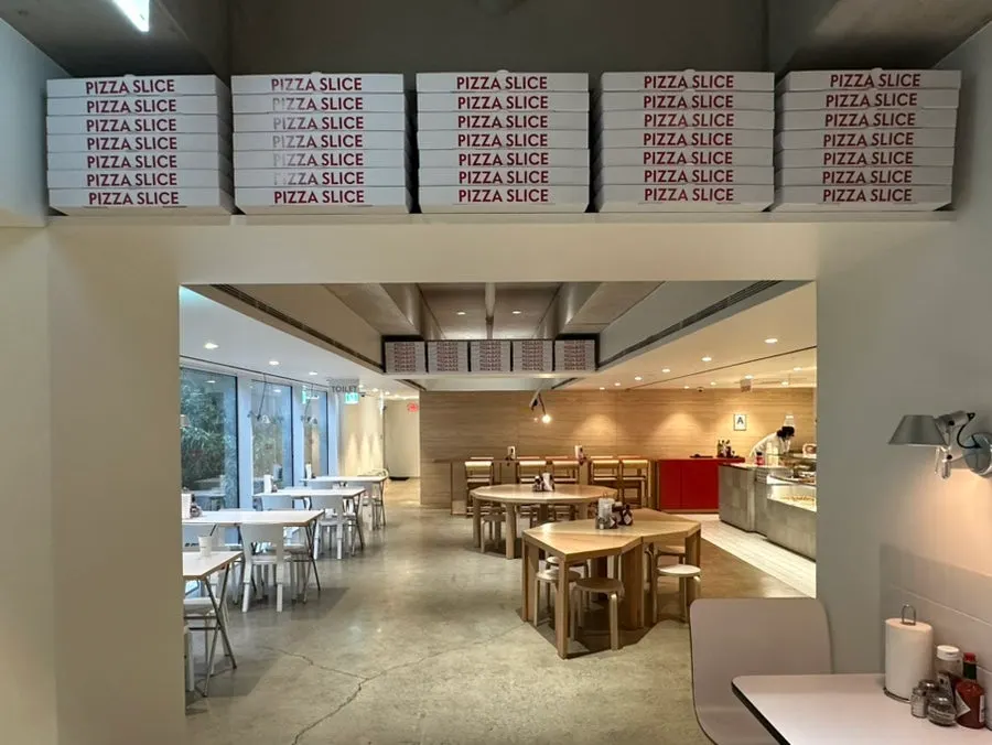 Seating good for solo diners and view of the shop