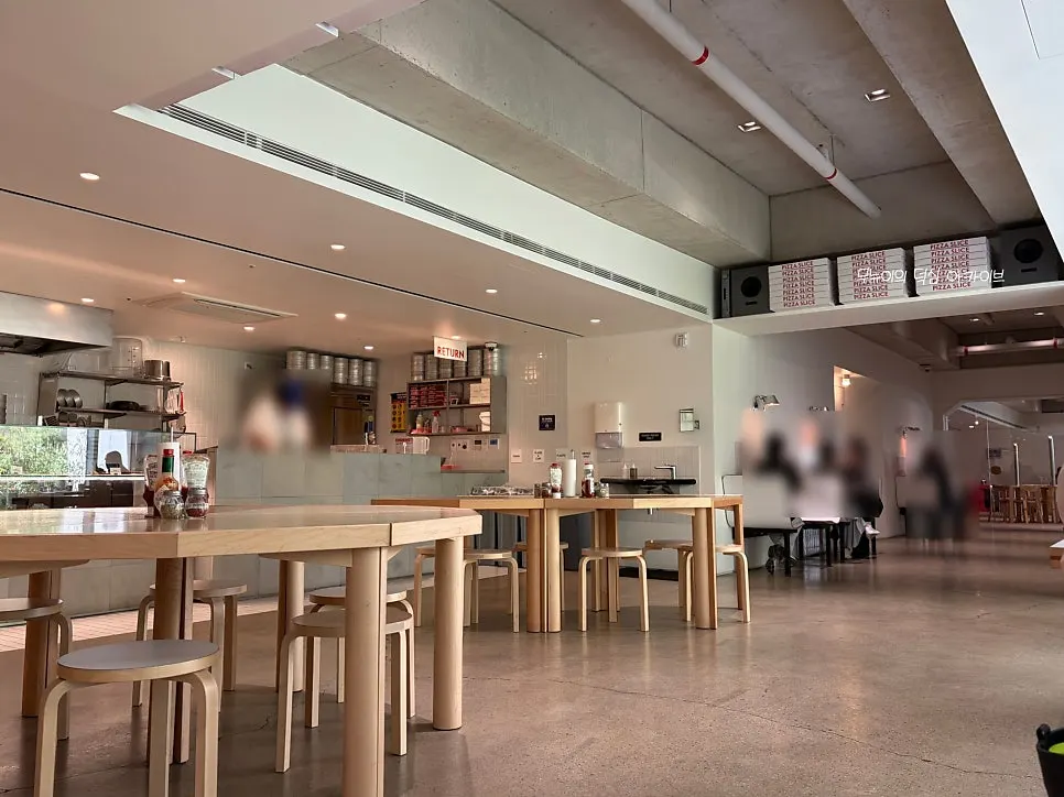 Interior of the restaurant with the open kitchen visible