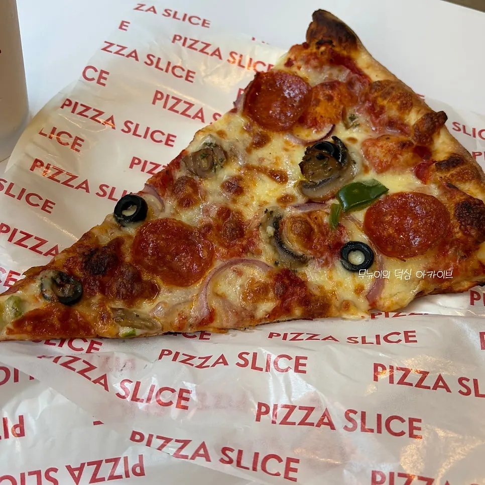 Slice pizza topped with jalapeño and cream cheese