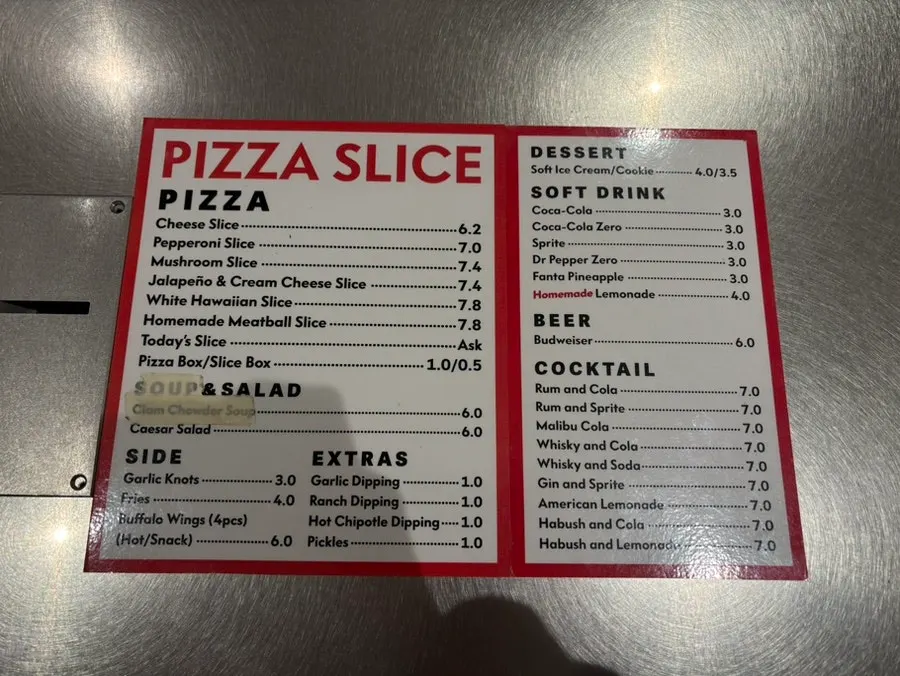 Menu board with slice pizza prices