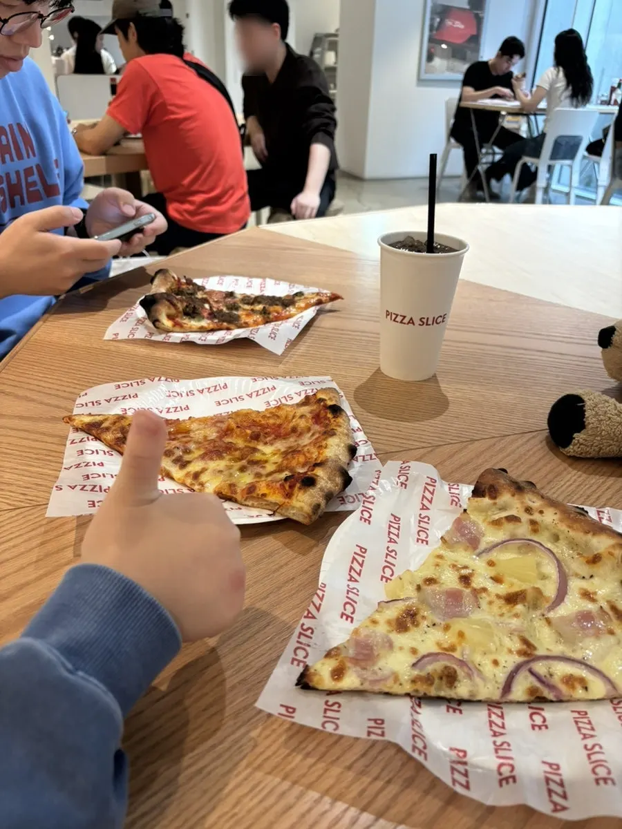 Freshly reheated, hot slice pizza