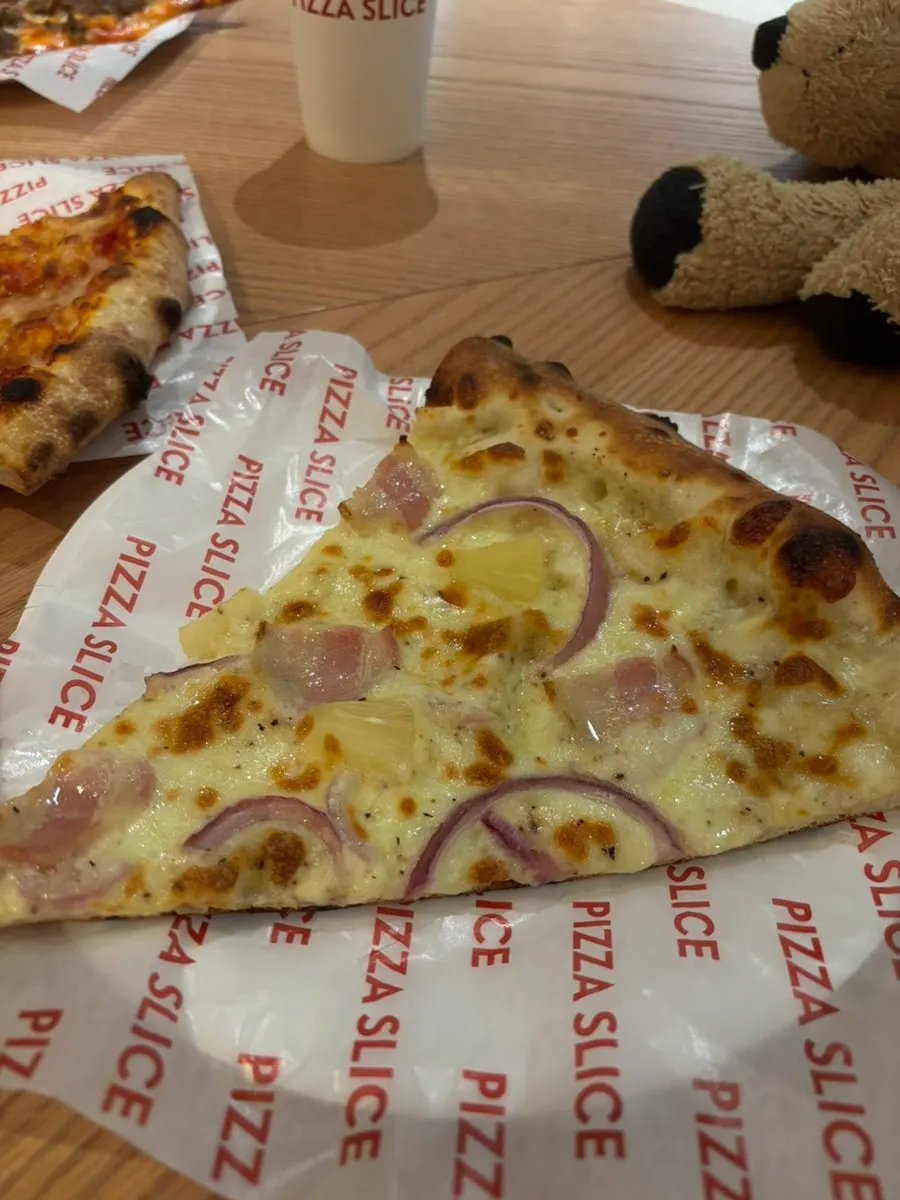 Cross-section of a slice pizza with stretchy cheese