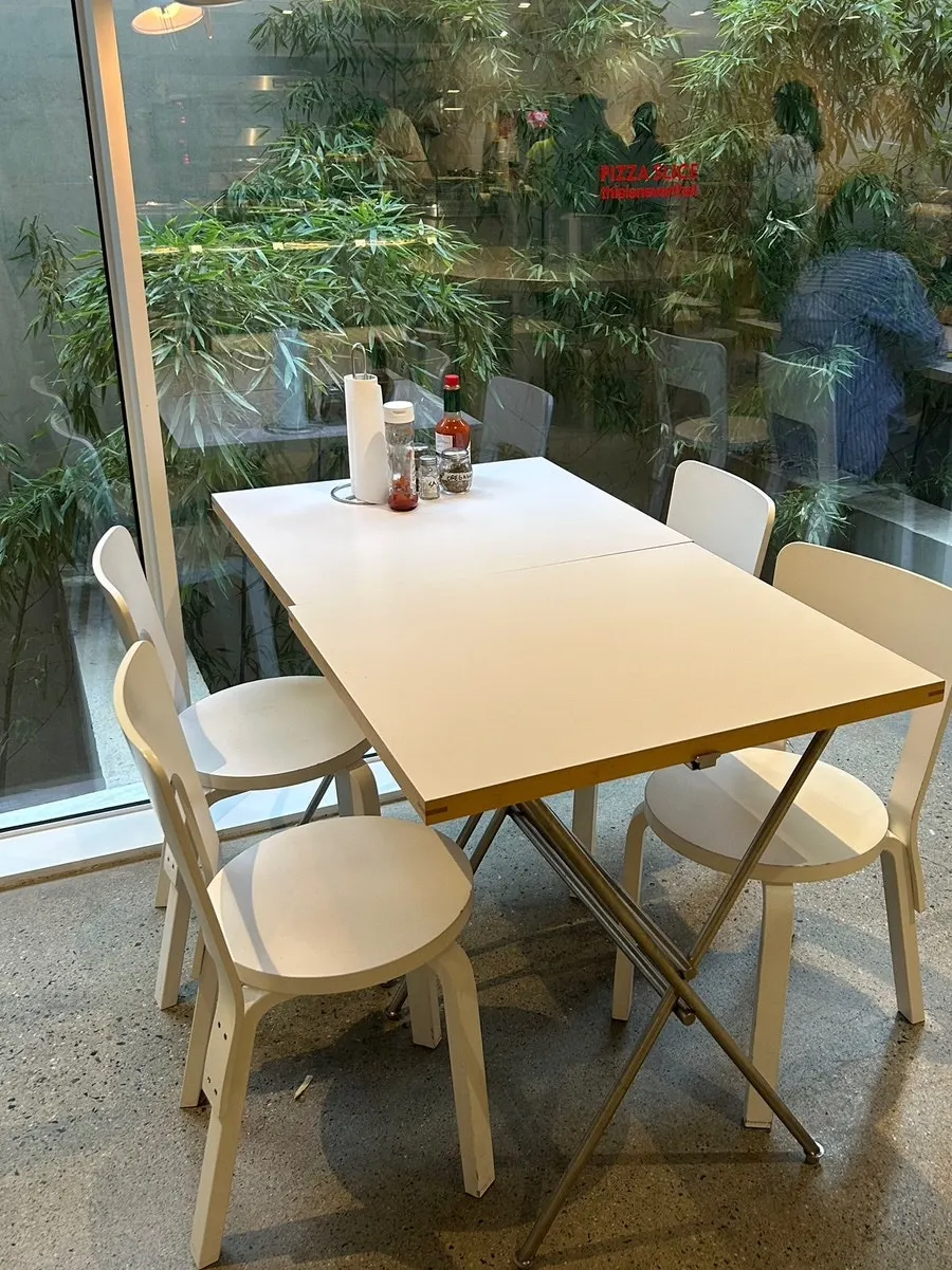 Hot sauce and seating at a table