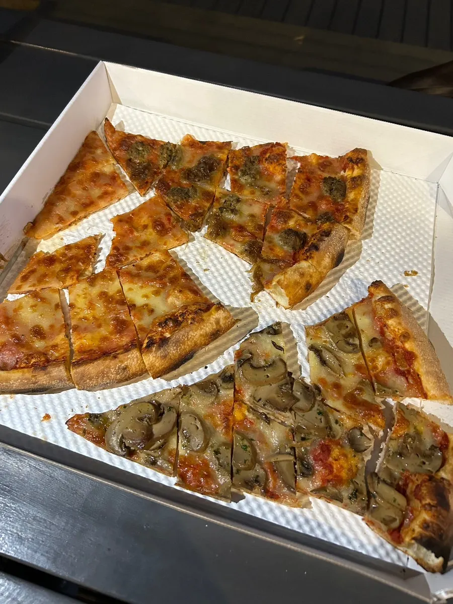 Three ordered slices of pizza and a Caesar salad