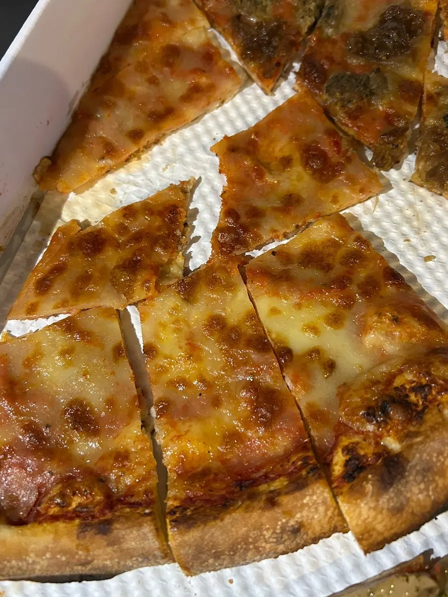 Pizza slice cut with a disposable knife