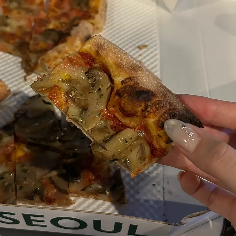 Eating the cheese slice at Seoul Forest