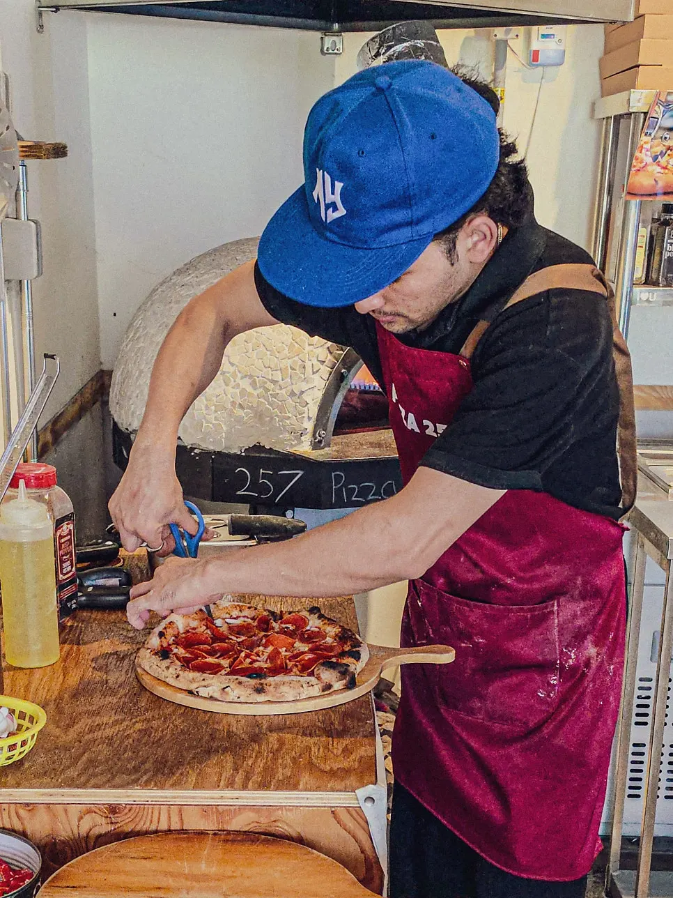 Pizza baking inside the wood oven