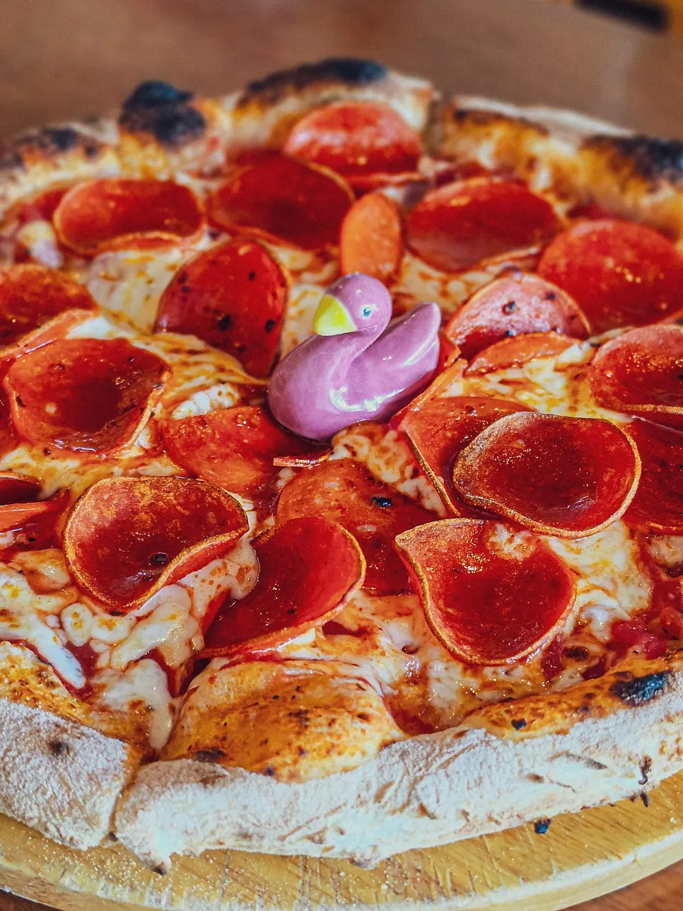 Freshly baked pepperoni pizza from the wood oven