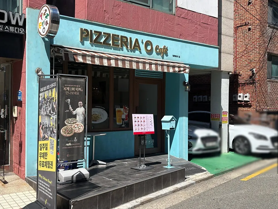 Restaurant entrance with brown-striped awning