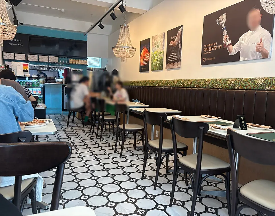 White-toned interior of Pizzeria O Hapjeong Station