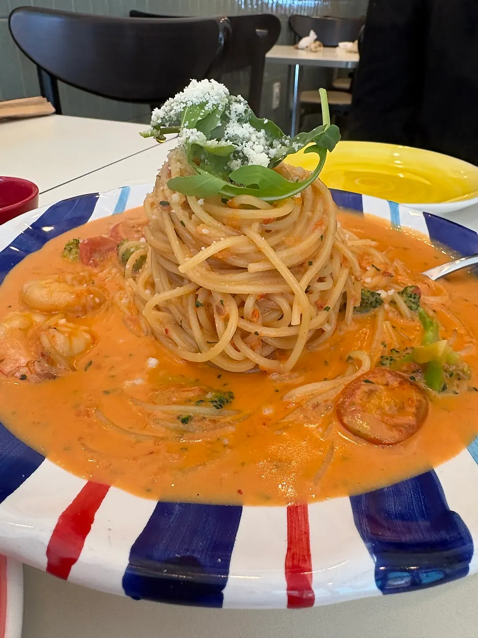 Rosé pasta noodles lifted with sauce coating them