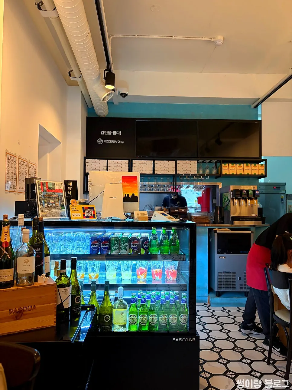 Warmly lit interior of Pizzeria O Hapjeong Station