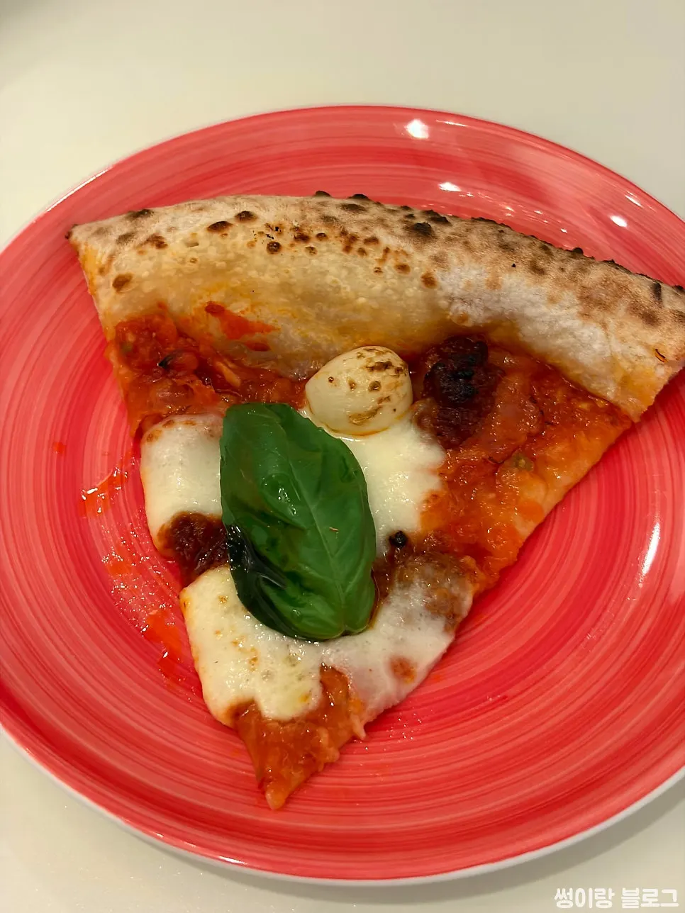 Cross-section of a slice of 'nduja pizza