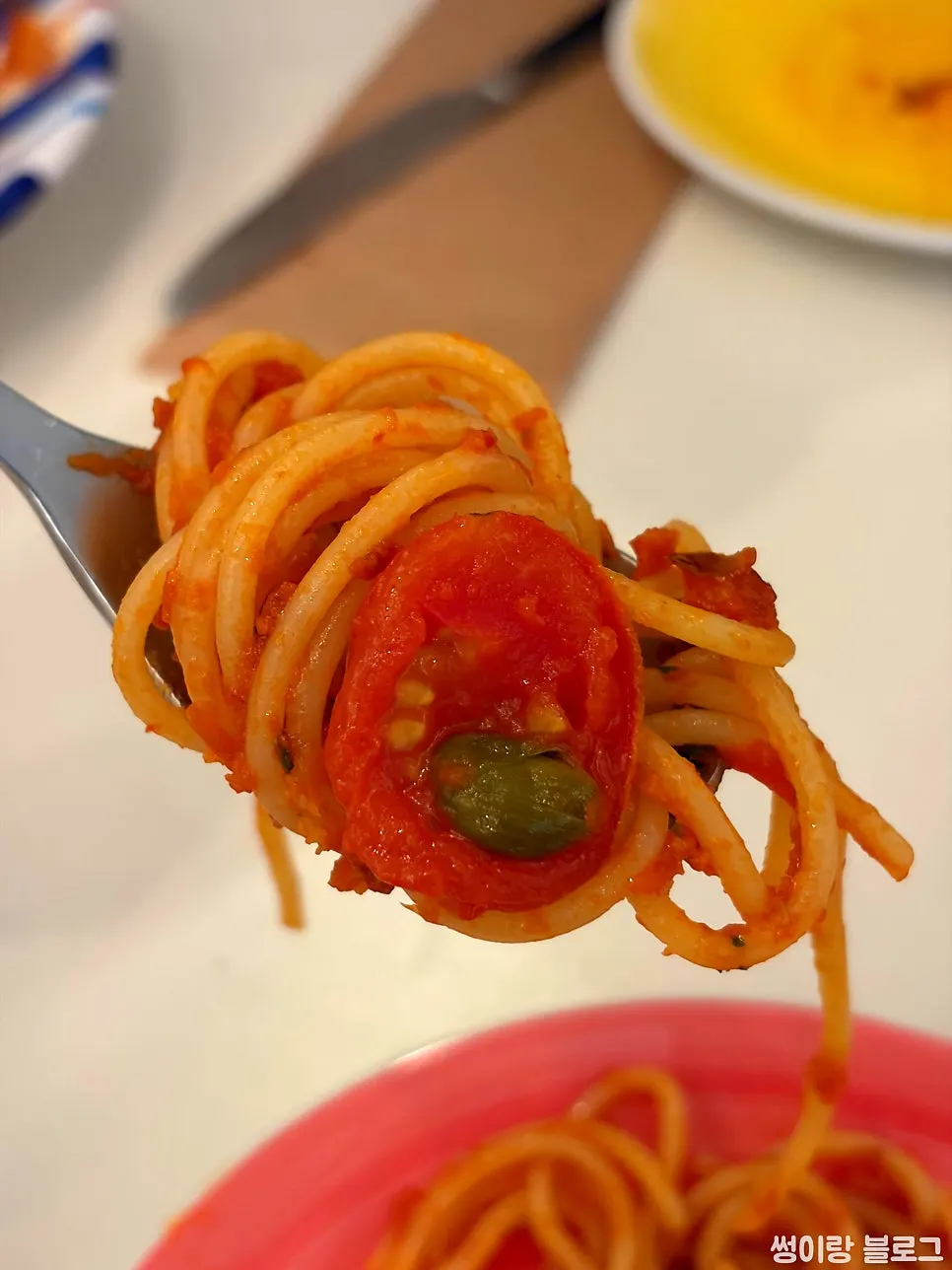 Close-up of puttanesca pasta noodles
